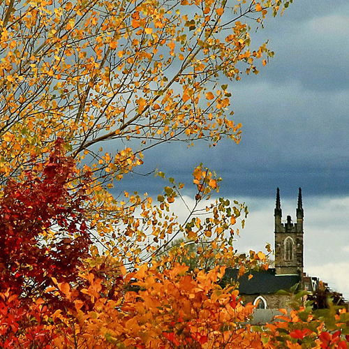 The historic Stone Church peers out from a sea of autumn hues in Saint John, New Brunswick Canada