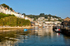 LO95  - A boat heads out to sea early morning at Looe