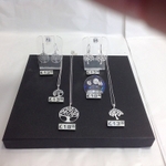 Silver tree of life pendants and earrings.