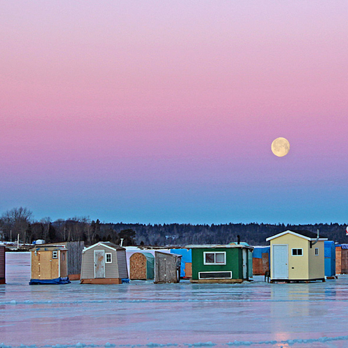 A new fishing day begins as the full moon sets over the Kennebecasis.