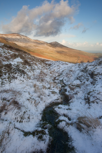 The little stream used as a lead in to point towards the summit of North Barrule.