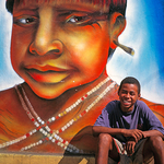 Portrait of a  Smiling Brazilian with a wall painting,  Rio, Brazil