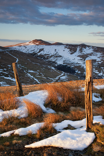Evening view between the posts across the Laxey Glen towards Clagh Ouyr and North Barrule.