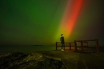 A visitor at High rock under the Northern Lights