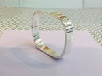 Silver chunky tv style bangle.   £115.00