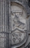 Façade, second story Franciscan insignia (right)