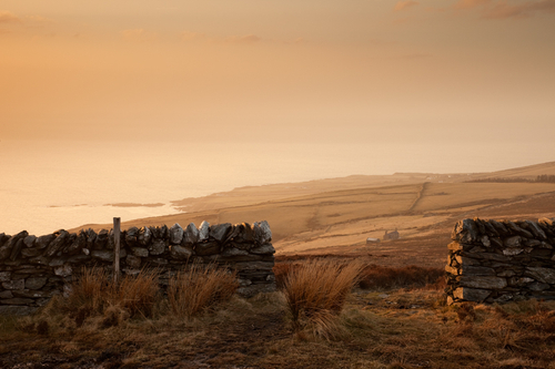 The view towards Dalby and Eary Cushlin through the hole in the wall on a hazy April evening.