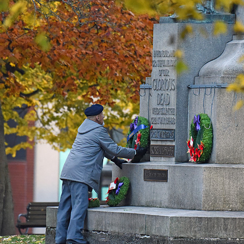 A  veteran places a commerative wreath in King Square, Saint John, New Brunswick, Canada.