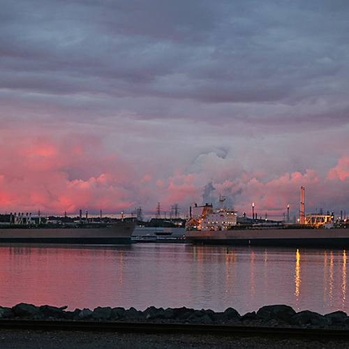 Docks 1 & 2 on the eastside of Courtenay Bay can be seen and with the Irving Refinery emissions reflecting the vivid…