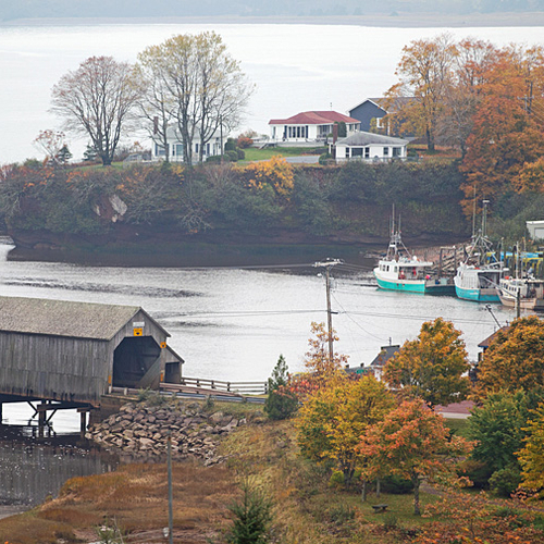 The St. Martins Harbor, wharf and covered bridge can be seen in this bird's eye view.