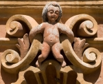 La Tercera Orden, façade, lower story niche relief, putto
