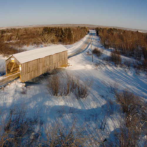 An elevated perspective of the Plumweseep Covered Bridge near Sussex, New Brunswick, Canada.