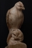 Karma - Buzzard on human scull sculpture.