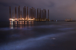 Moon beams and oil rigs