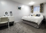 One end of the double bedroom