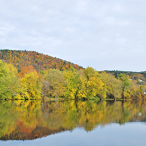 The Kennebecasis River reflects autumn splendor at Hampton, New Brunswick.