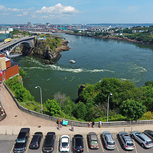 The World Famous Reversing Falls and with the City of Saint John, New Brunswick in the background.