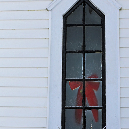 A festive church window shows the effects of the icy blast ....... several days after the storm.