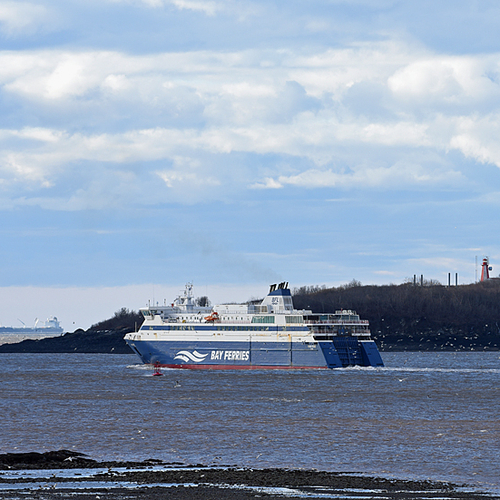 Bay Ferries' Fundy Rose is seen departing Saint John, NB and with historic Partridge Island in the immediate background.
