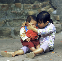 KM-73 Girl looking after her little brother, Kao Sai Chau - 1978