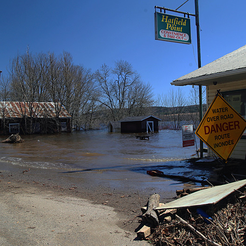 Floodwaters along Route 124 @ Hatfield Point, NB turn road into beach front.