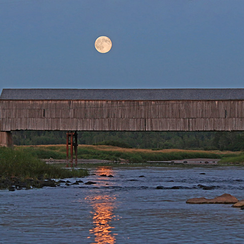 A full moon bridges itself along the Hammond River on Route 860 in French Village(now apart of Quispamsis), New Bruns…