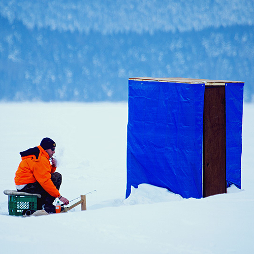 An ice fisherman tries his luck off Renforth Wharf and along the Kennebecasis River @ Rothesay, NB.