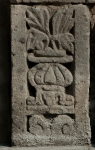 San Lorenzo, façade portal, alfiz base relief (left)