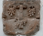 San Miguel, façade alfiz left relief, Cross & wounds