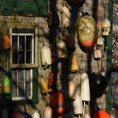 An old barn adorned in buoys and kissed by morning shadow light @ Campobello
