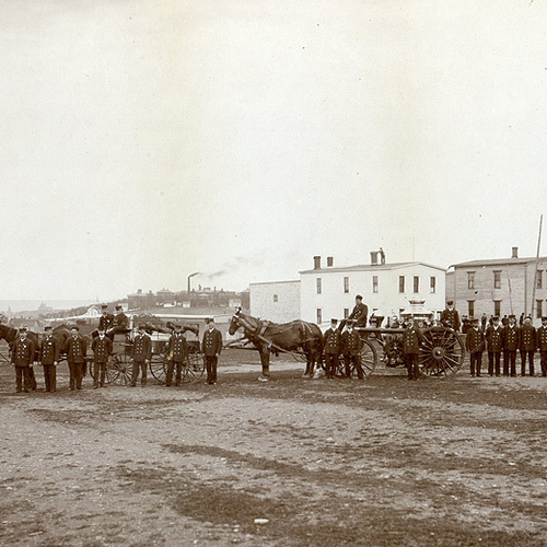 An early albumen of a St. John firemen's brigade posing along the west(Fairville) side of the St. John River with the…