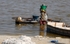 Senegal Lac Rose salt production 7 woman carrying salt from boat to sh