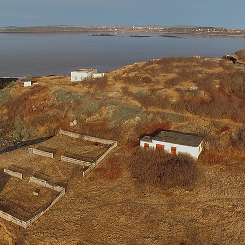 Aerial view and with early morning sunlight illuminating cemetery plots on the southwest corner of Partridge island.