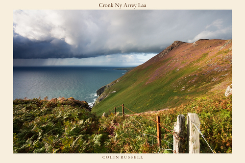 The slopes of Cronk Ny Arrey Laa with the heather in full force and heavy showers coming in off the Irish Sea.