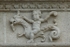 Façade architrave relief, putto aloft hippocamp