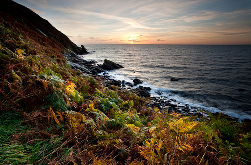 End of October on the South West Coast of the Isle of Man. The colours of the setting sun competing with the colourfu…