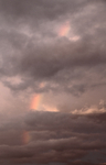 Sunset Rainbow Between Cloud Layers