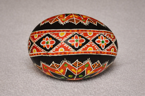 The artist paints with precision and distinction. Many long hours are spent on each egg that the artist paints.  Phot…