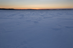 Sunset across one of the frozen lakes in Northern Lapland, Finland