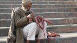 Delhi Jama Masjid man sitting on steps