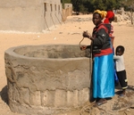 Senegal Fulani village woman at well