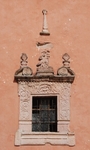 San Juan Bautista, façade, bell-tower base, window relief