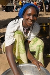 Senegal Fulani Village Fulani woman preparing food in bowl detail
