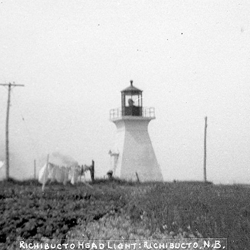 An early 20th-century view of the Richibucto Head Lighthouse in Kent County, New Brunswick, Canada. A clothesline wit…