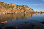 Golden morning reflections at Anstey's Cove
