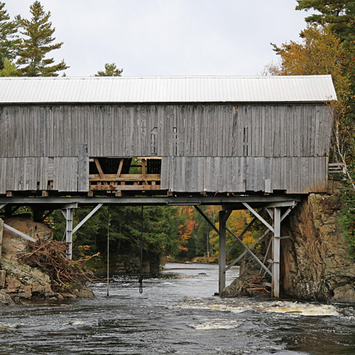 The 63 ft (19 m) covered bridge spanning the Magaguadavic river at Flume Ridge. It was constructed in 1905.