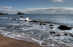Quiet morning as the waves break at low tide