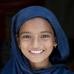 Smiling girl with blue Shawl, India