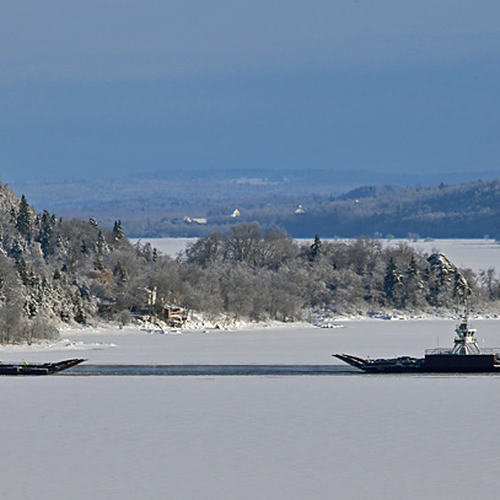 The Gondola Point Ferries work in tandem amidst an icy backdrop.