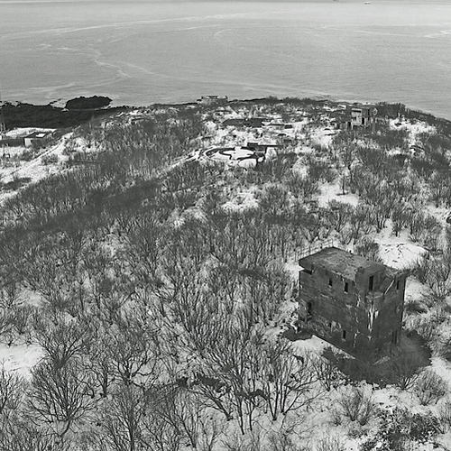 Looking towards the west side of Partridge Island and the existing building remnants and foundation shells. The build…
